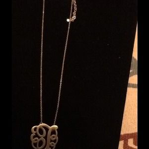 Gold tone monogram letter T necklace