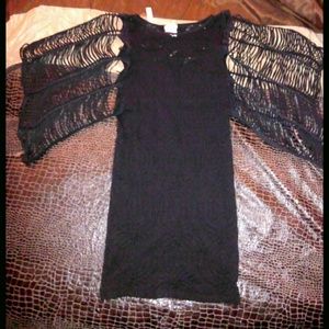 Black fitting dress with see through flowing arms