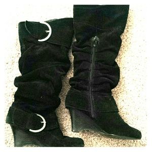 Naughty monkey tall black boots.