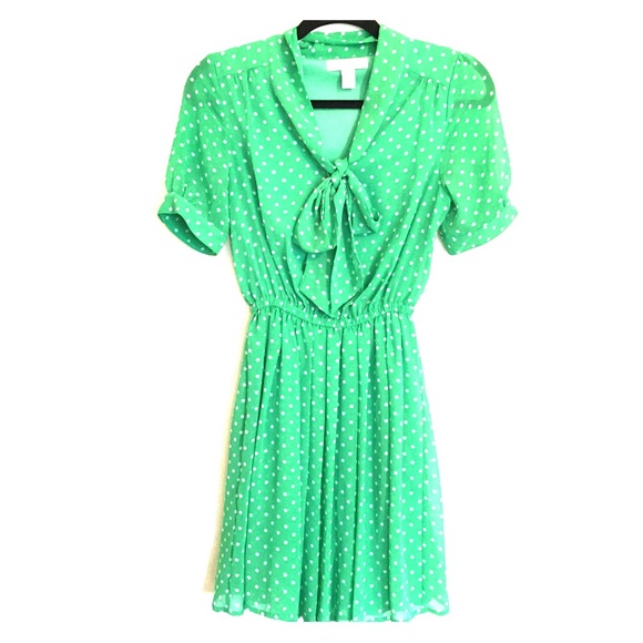 Green dress with white polka dots.