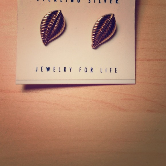 Gold fern/leaf earrings from Icing