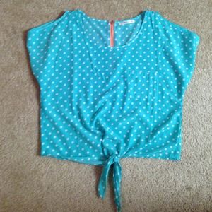 Poka dot top with a neon orange zipper!