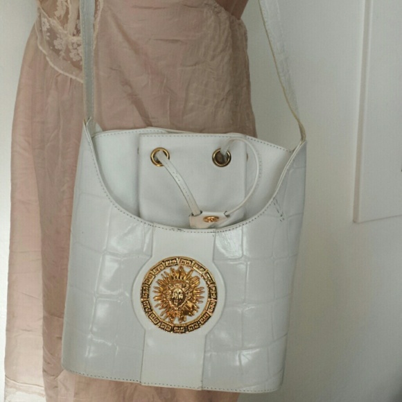 White with gold metal handbag