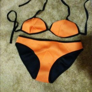 Size small coral orange bikini. Never worn.