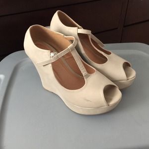 Nude wedges.