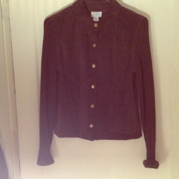 Leather jacket with knit sleeves.