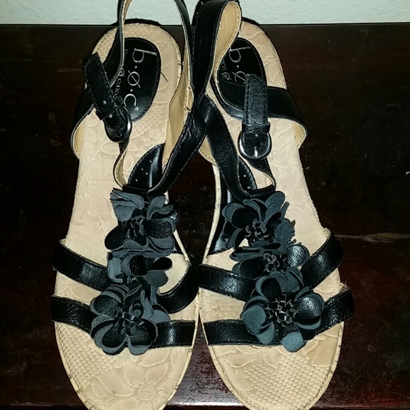 Black straps w/ flowers cork screw wedges