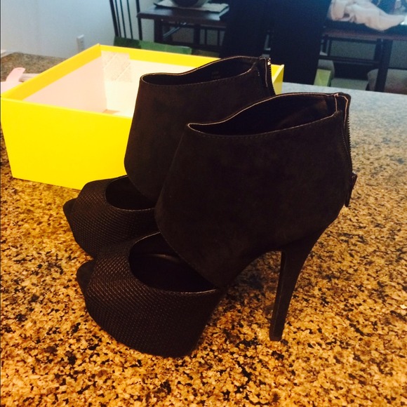 Never worn paper fox high heels.