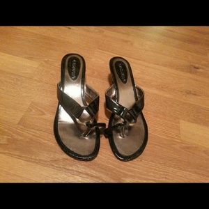 Black sandals with short heel.