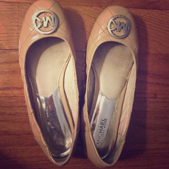 Michael Kors beige ballerina flats.