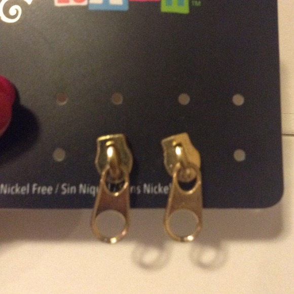 Gold zipper earrings.
