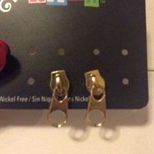 Gold zipper earrings.