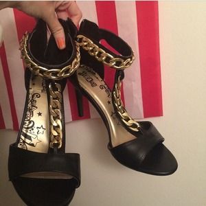 Black high heels with chains.