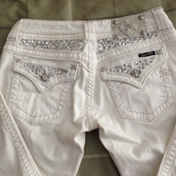 White denim Miss Me jeans.