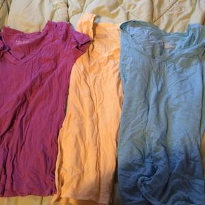 Purple, yellow and blue v-neck shirts