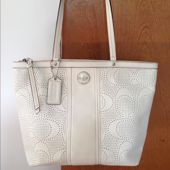 Coach perforated white leather purse.