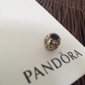 14k gold and sterling silver Pandora "A" charm.