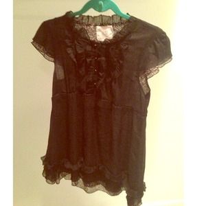 Black long top, ruffle and button details!