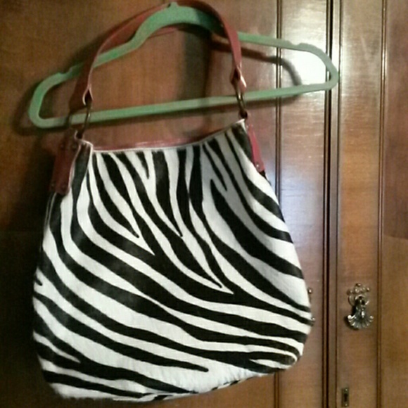 Maurizio taiuti purse