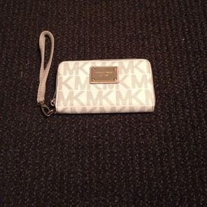 Authentic Michael Kors monogram wristlet wallet