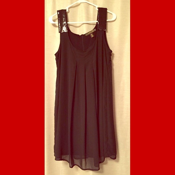 Black chiffon sleeveless dress.