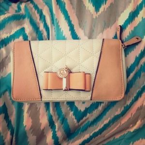 Double zip mint bow wallet by Jessica Simpson