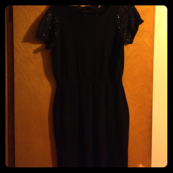 Black sweater dress w/sequins on the sleeves NWT