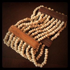 Tan bead and wood stretch bracelet.
