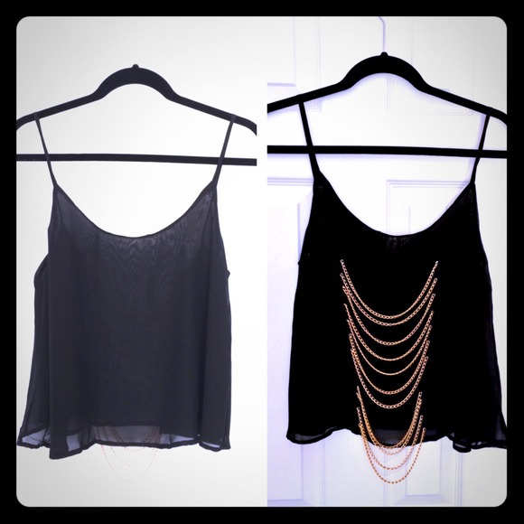 Sheer blouse with open back and gold chains