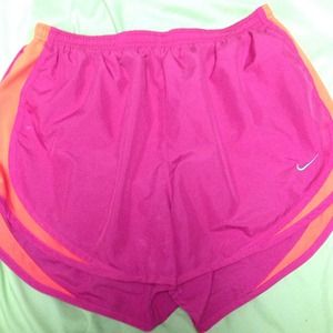 Fushia and orange Nike tempo