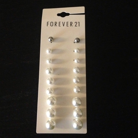 Set of 9 faux pearl earrings. 8 white/1 silver.