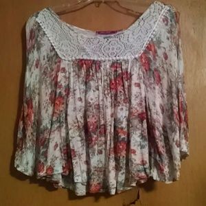 Cream top with with orange flowers