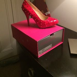 Spiked red heels