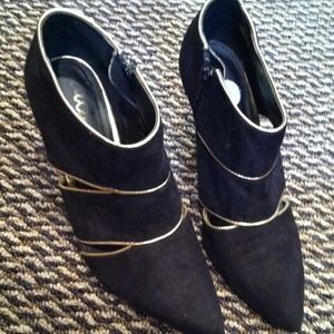 Gold and black heels