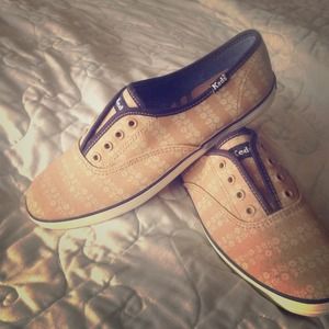 Navy and tan tennis shoes