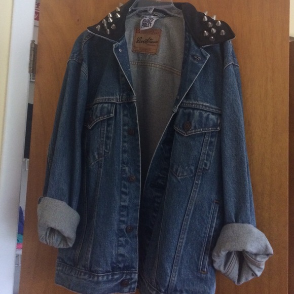 Denim jacket with leather collar and studs.