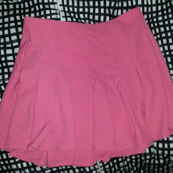 A coral/hot pinkish tennis skirt