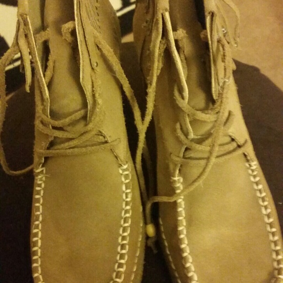 Tan boots and Prada bundle