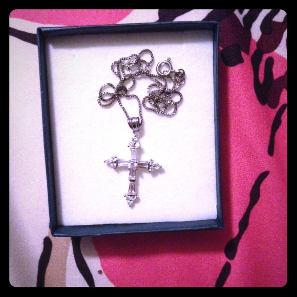 A sterling silver cross necklace.