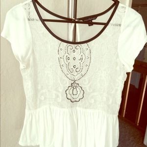 Women's white lace peplum top.