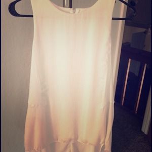 White zip-back hi-low top.