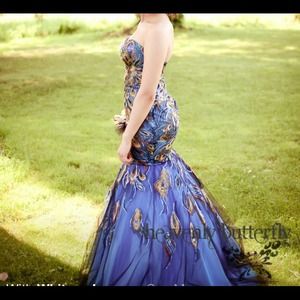 Peacock embroidered prom dress.
