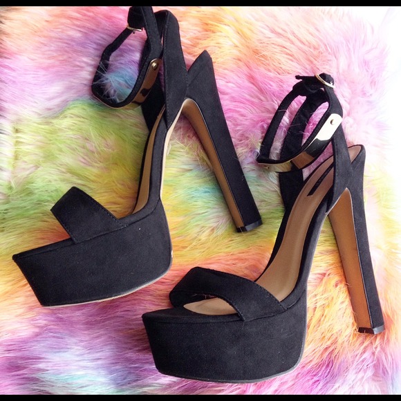 Black suede heel with gold ankle clasp