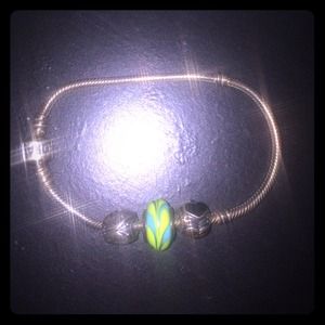 Silver pandora bracelet with three charms