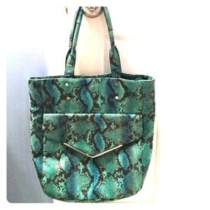 Blue, green, and black snake skinned designer bag