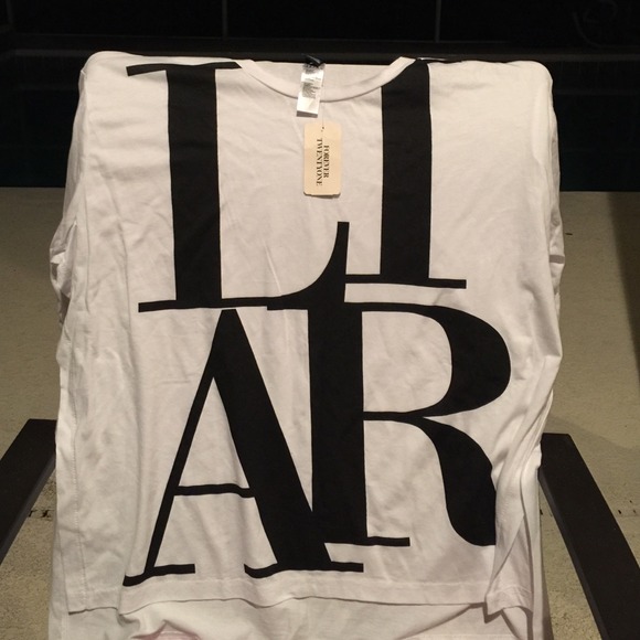White shirt with Liar written in black
