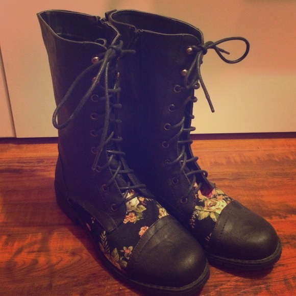 Black combat boots with floral detailing