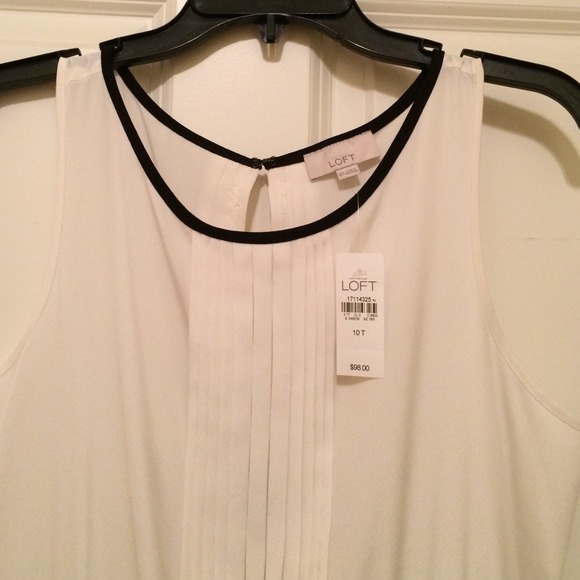 NWT jumpsuit. Cream pleated top & black bottom