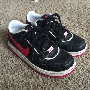 Pink and black nike shoes