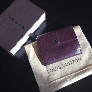 Authentic Louis Vuitton Ludlow Monogram Coin Purse
